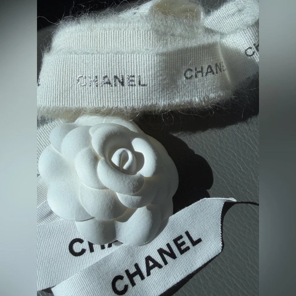 CHANEL 1 CAMELIA FLOWER AND Silver Chanel printed RIBBON,  plus Chanel card.